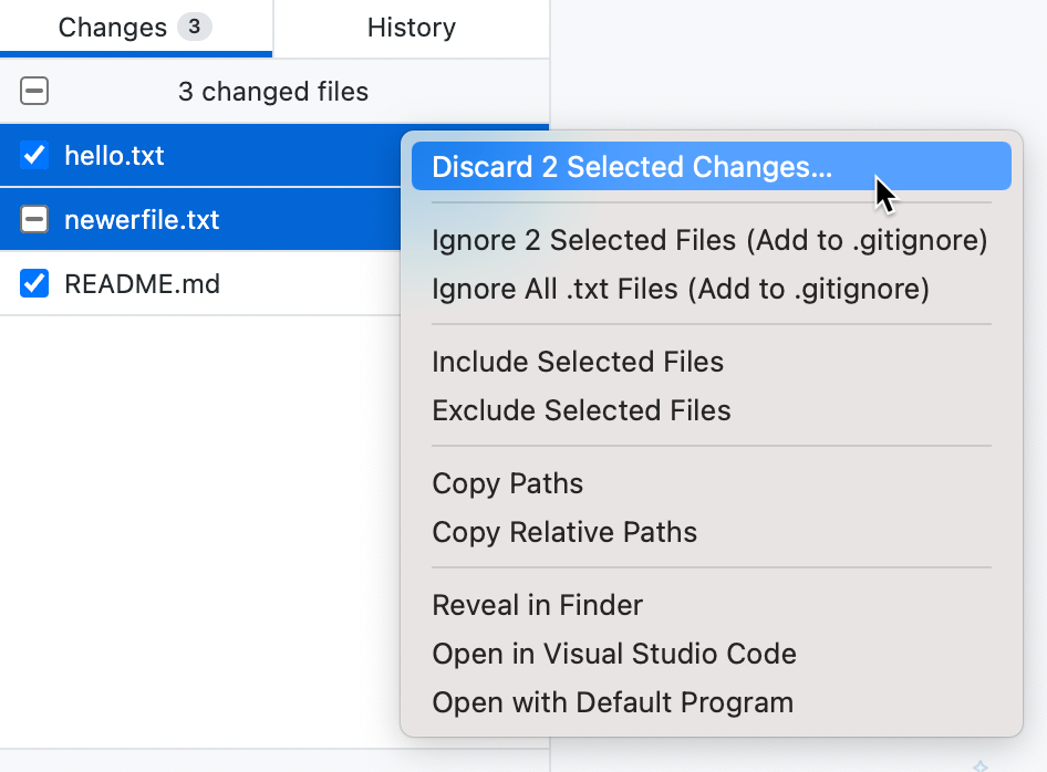 Captura de pantalla de la pestaña "Cambios". Hay dos archivos seleccionados resaltados en color azul. En un menú contextual, el cursor mantiene el puntero sobre "Descartar 2 cambios seleccionados".